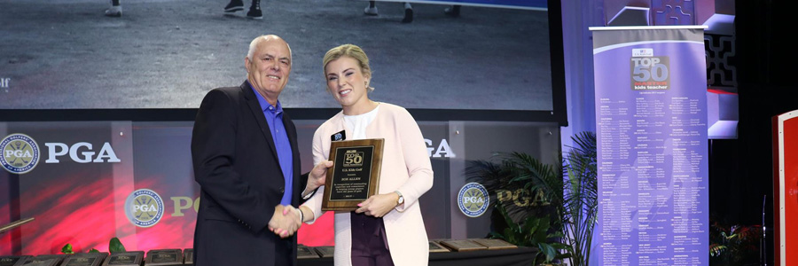 Zoe Allen receives the US Kids top 50 Coach award from Dab Van Horn